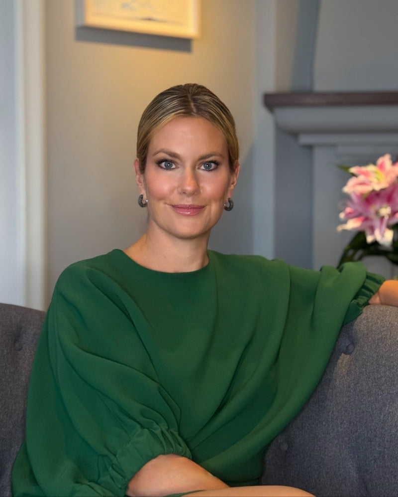 Image of founder Kim Lindqvist in a green dress
